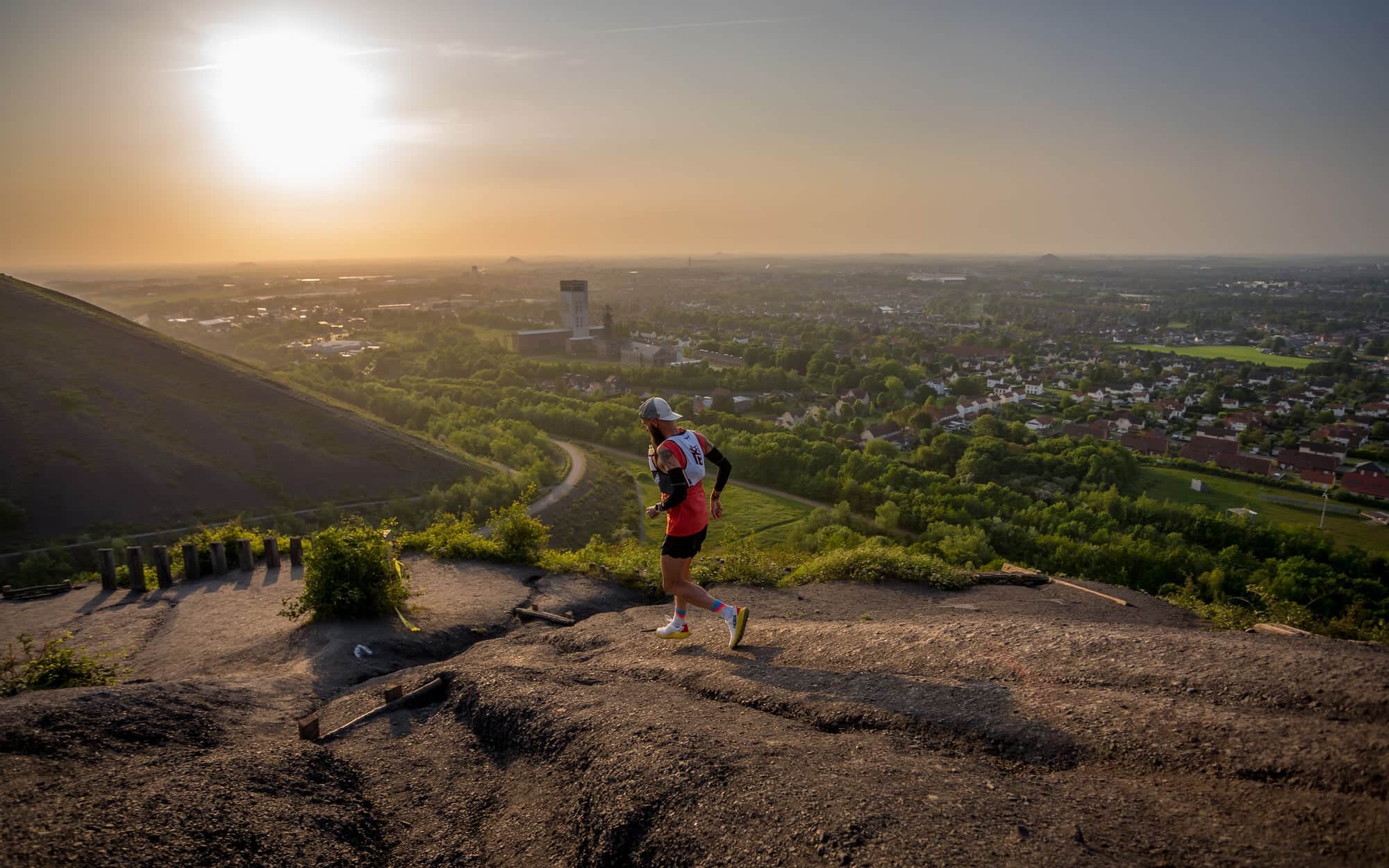 Runner on a hill at sunset
