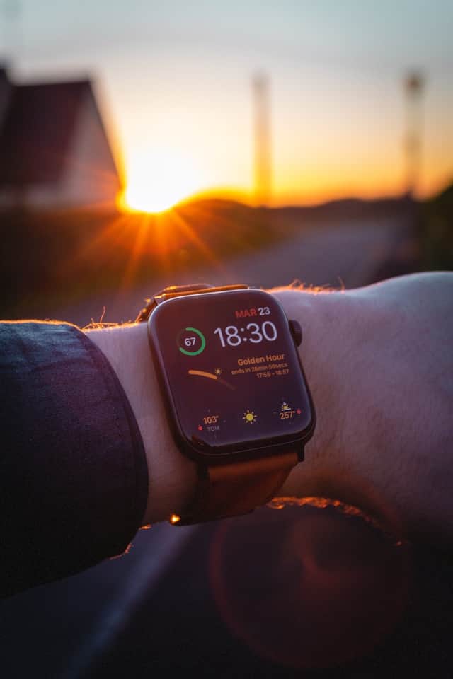 Runner reviewing statistics on a sports watch