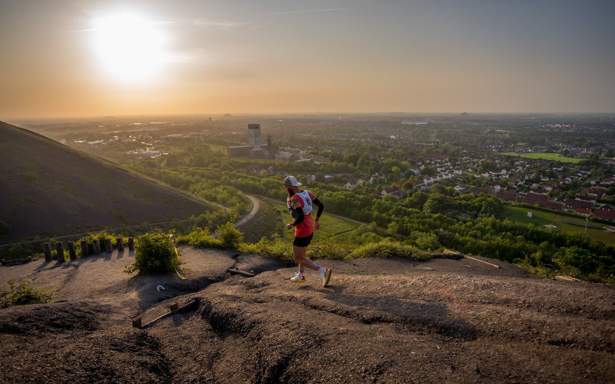 Runner on a hill at sunset