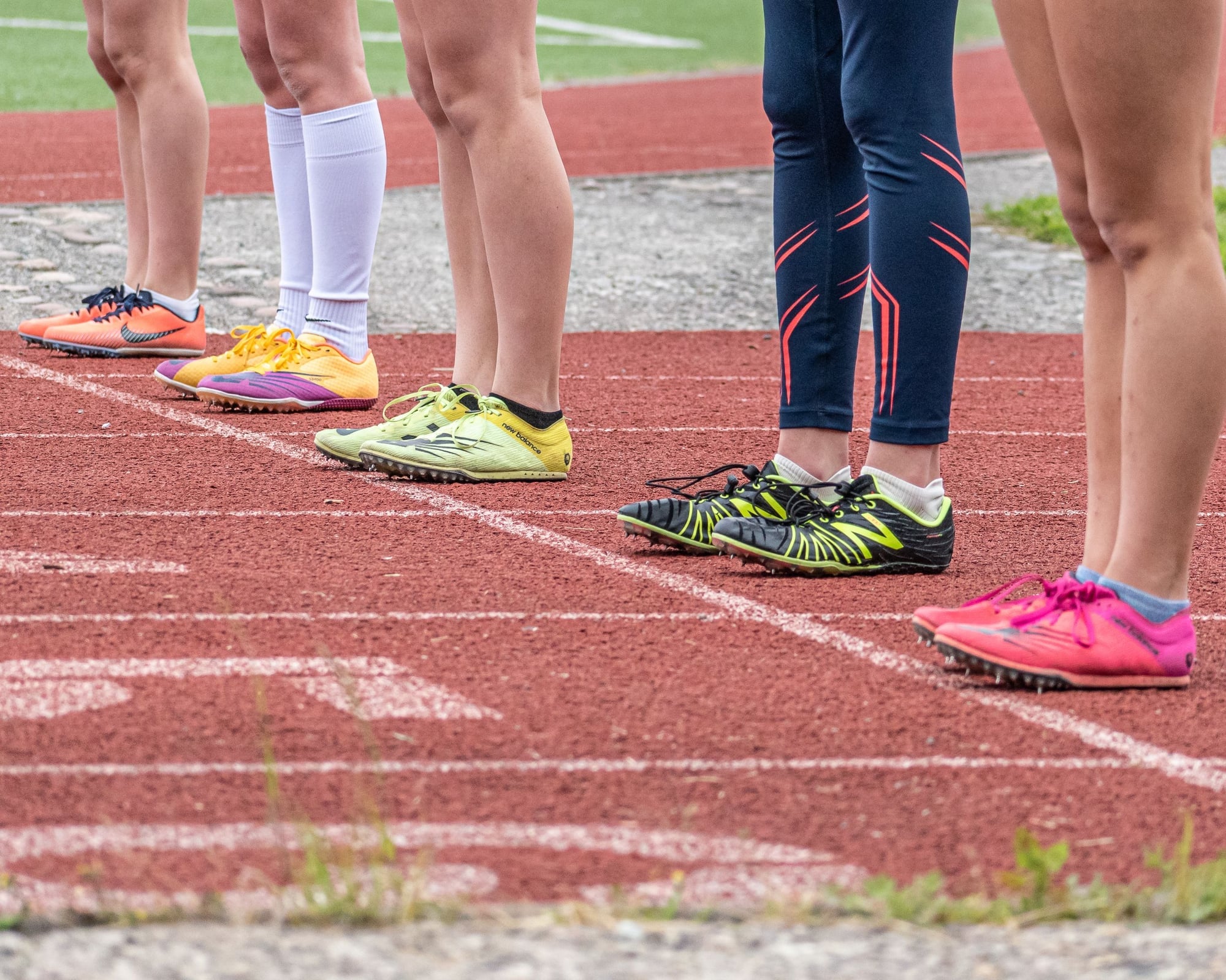 Running shoes of a group on an athletics track