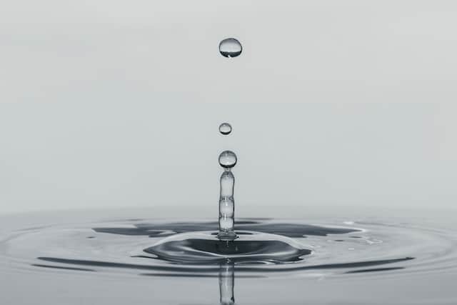 Zen water splashing upward from impact